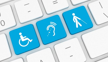 Computer keyboard with keys labelled with wheelchair, hearing loss graphic and a walking aid in blue.